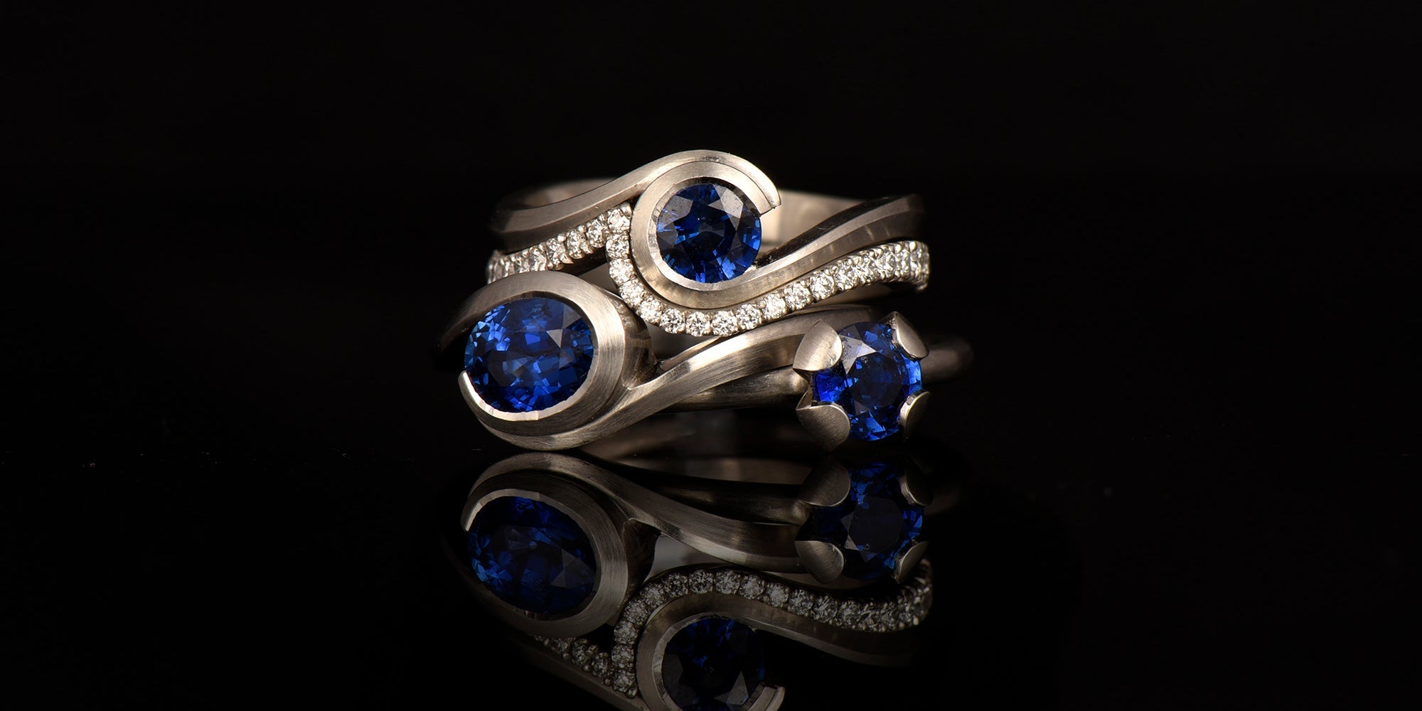 Sapphire and platinum 4 claw engagement ring