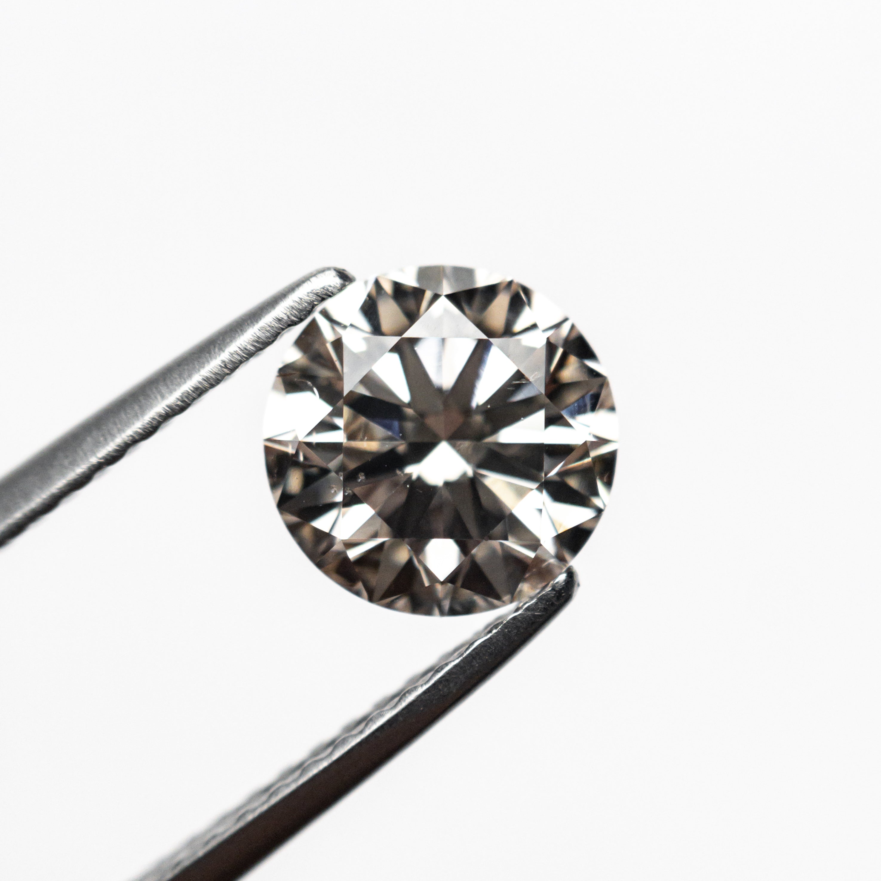 1.61ct 7.34x7.27x4.62mm SI1 C3 Round Brilliant 19562-01