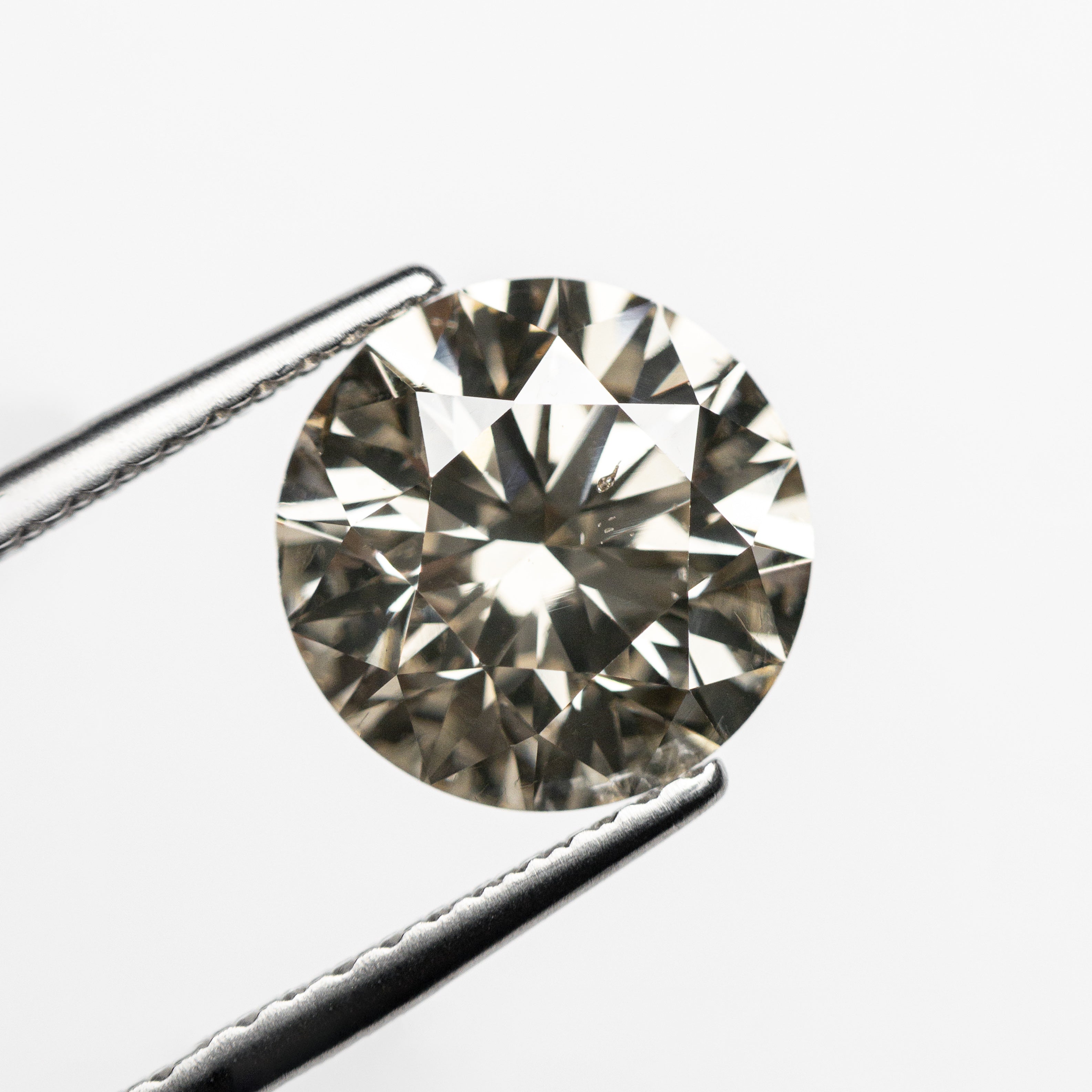 2.46ct 8.67x8.65x5.43mm SI1 C3 Round Brilliant 23634-01