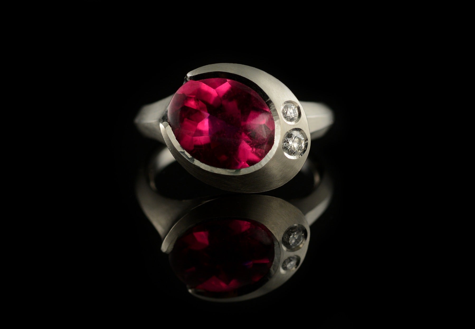 Arris rubellite and white diamond platinum ring