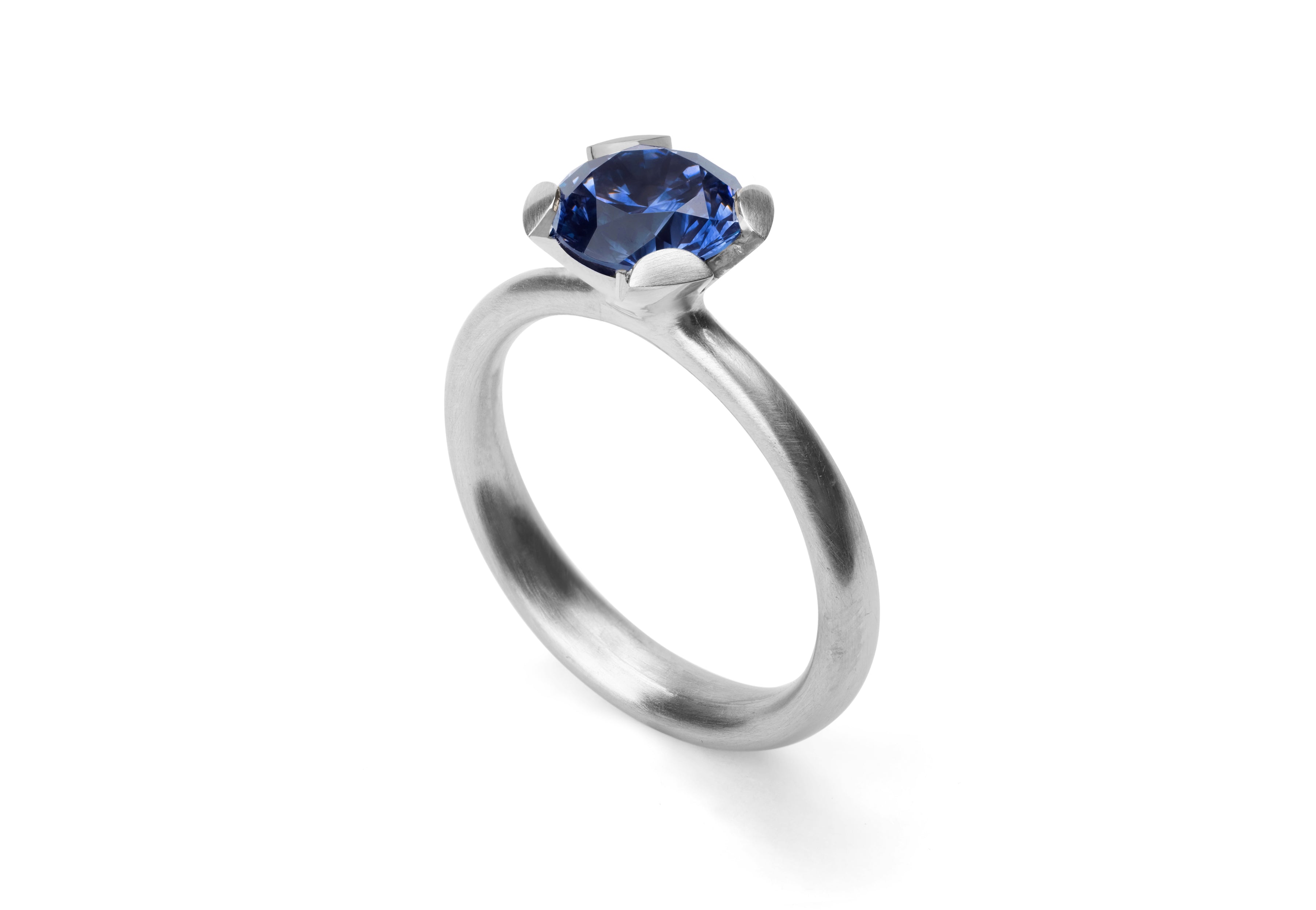 Platinum Calyx engagement ring with blue sapphire