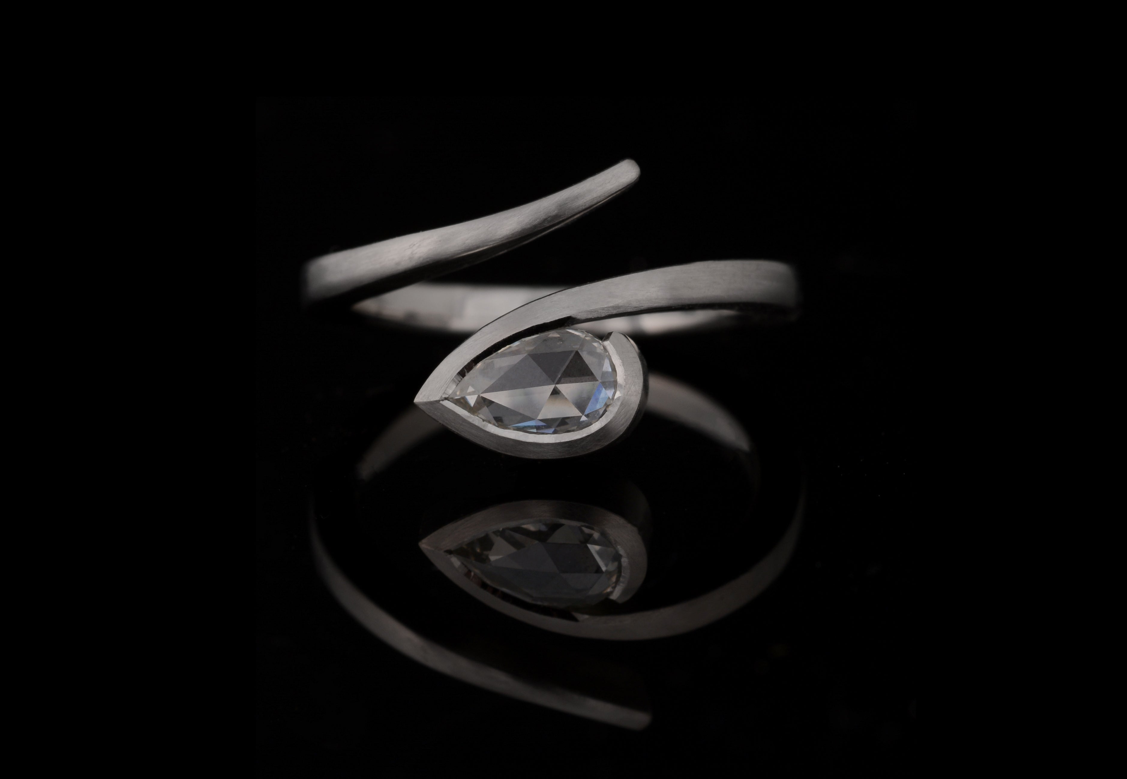 'Twist' Platinum and white pear shaped rose cut diamond engagement ring