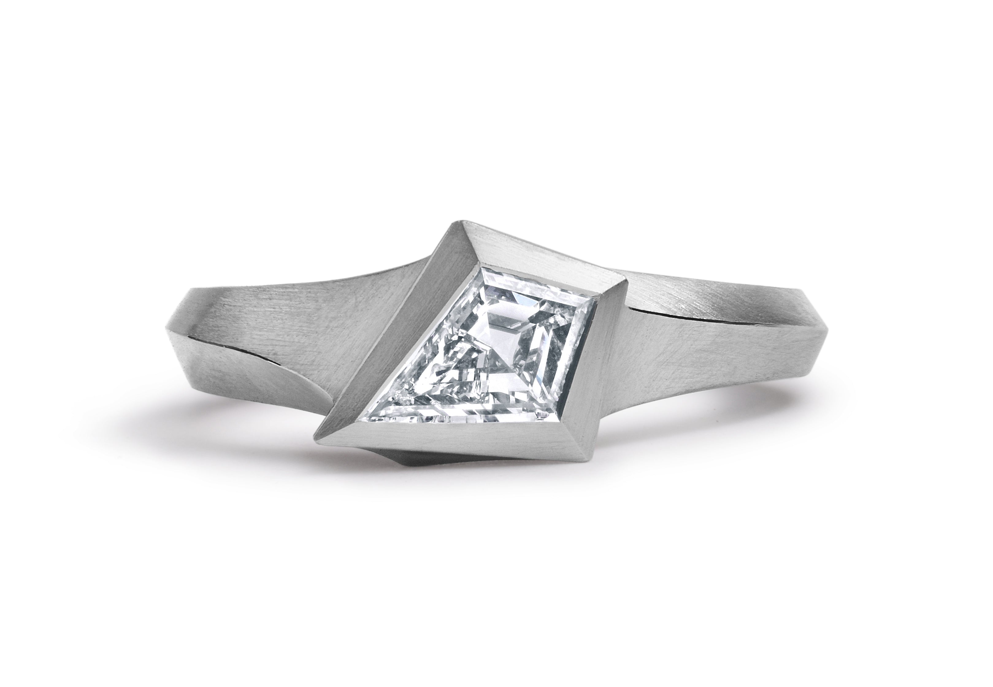 Platinum Aegis ring with kite shaped white diamond. 